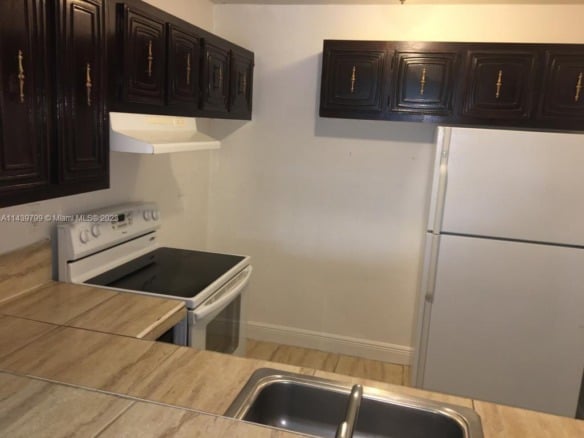 498 NW 165th St Rd # D205, Miami FL 33169 — #A11439799