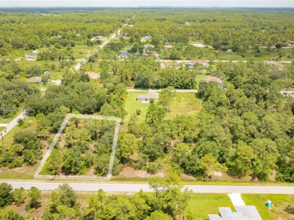 1420 Clayton Ave, Lehigh Acres FL 33972 — #A11565171