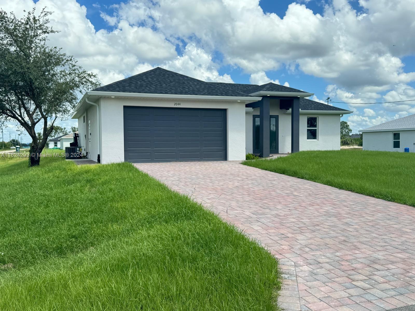 2044 Crawford Ave N, Lehigh Acres FL 33971 — #A11624293