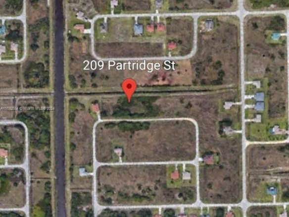 209 Partridge St, Lehigh Acres FL 33974 — #A11692584