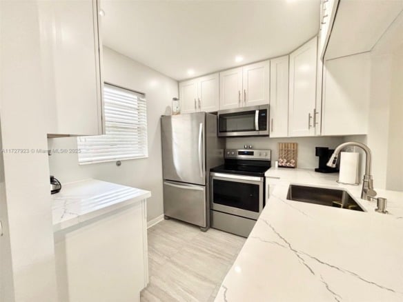 3405 NW 48th Ave # 407, Lauderdale Lakes FL 33319 — #A11727923