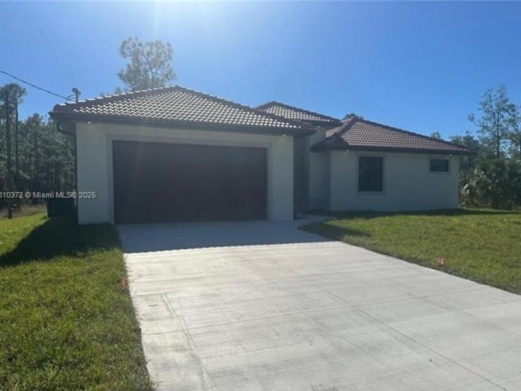 2002 E 13th St, Lehigh Acres FL 33972 — #A11810372