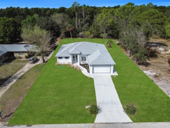 1215 Fitch Ave, Lehigh Acres FL 33972 — #A11825074
