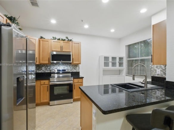2851 W Prospect Rd # 307, Tamarac FL 33309 — #A11842985