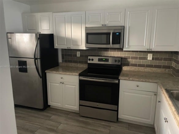 1075 Riverside Dr # 203, Coral Springs FL 33071 — #A11853788