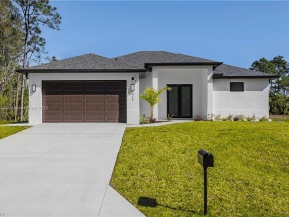 821 Newell St E, Lehigh Acres FL 33974 — #A11871339