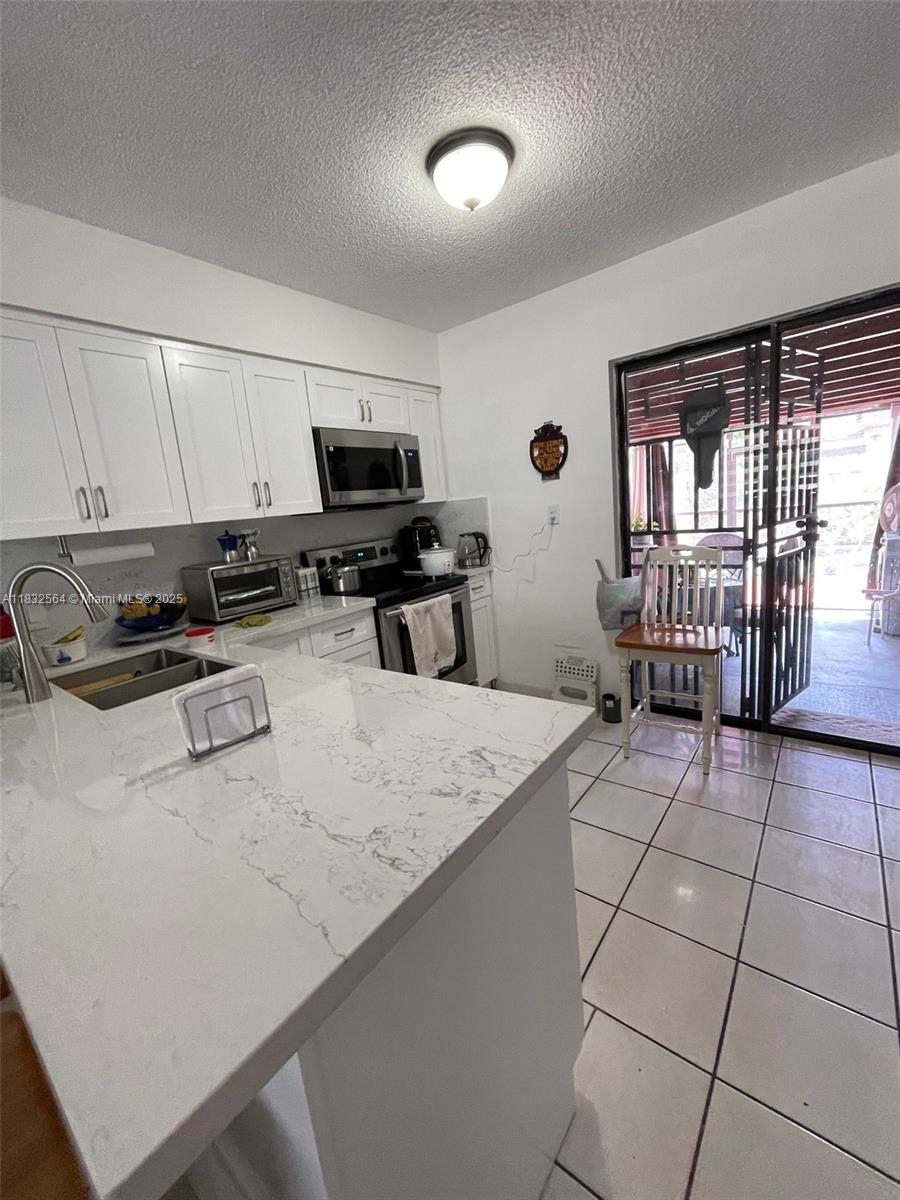 6dd28e9b-1372 12057 SW 10th St # 202, Miami FL 33184 — #A11832564