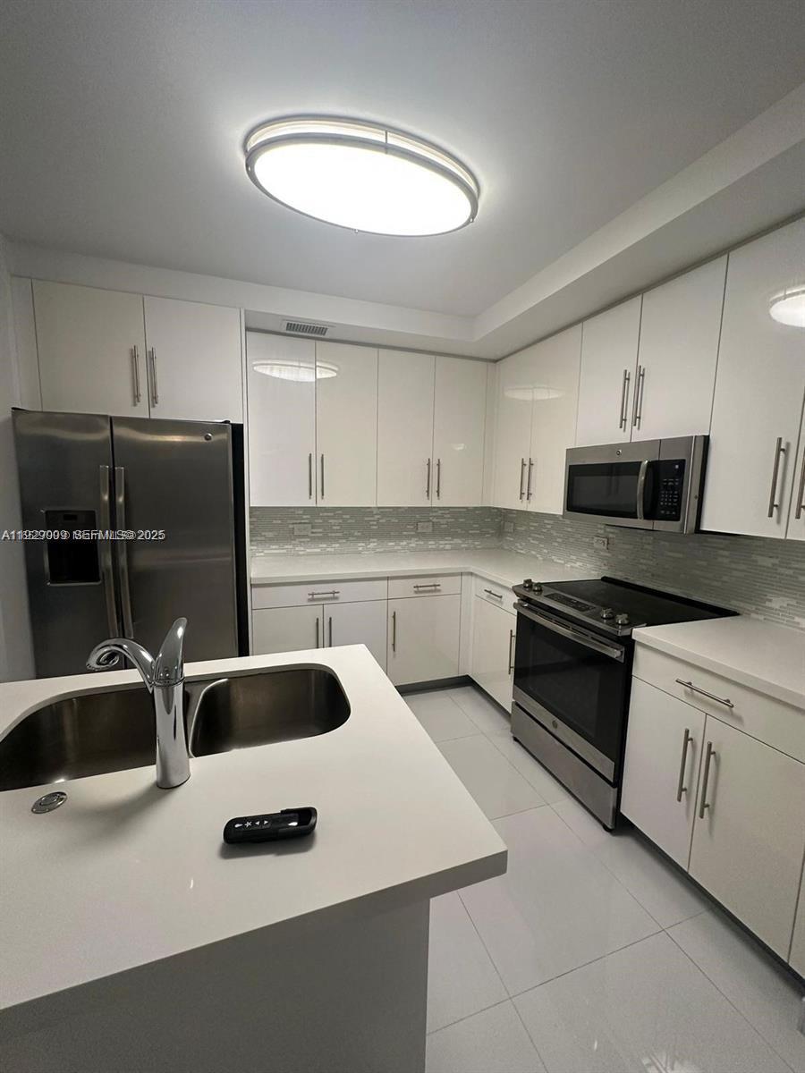 6dd28e9b-1464 2651 NE 212th Ter # 400, Miami FL 33180 — #A11929009