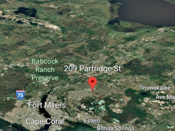 209 Partridge St, Lehigh Acres FL 33974 — #A11692584