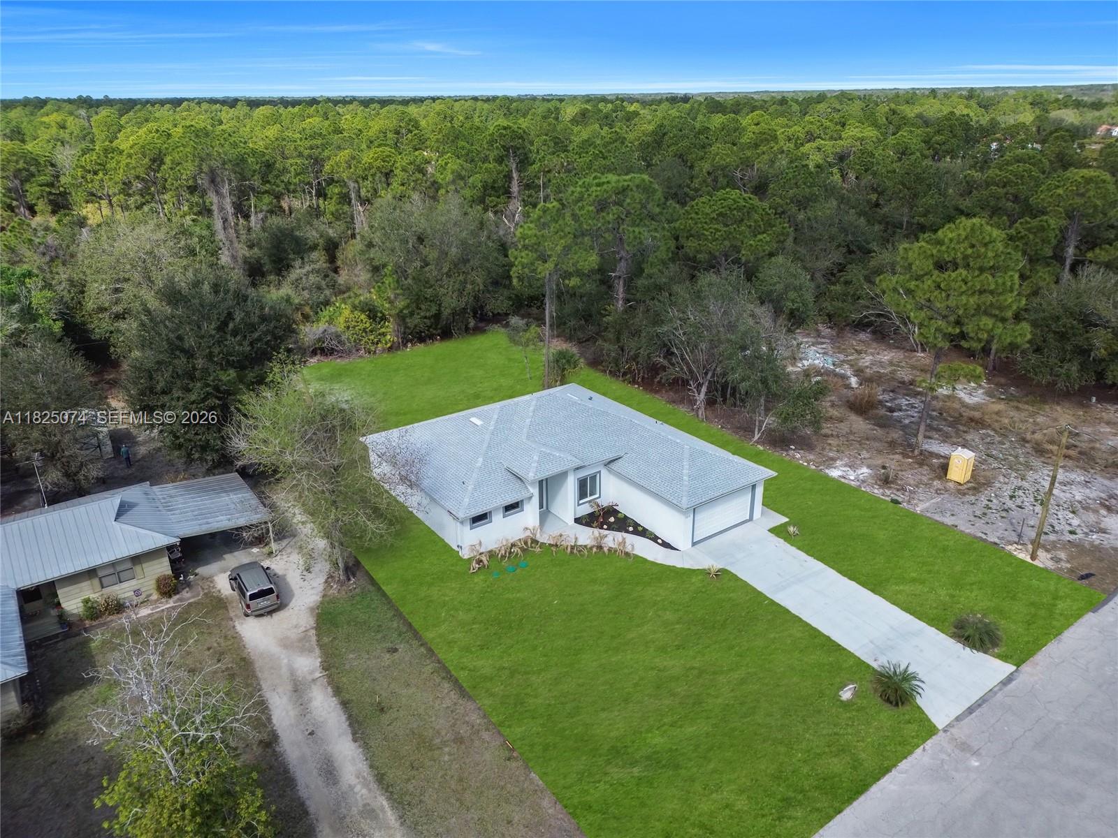 1215 Fitch Ave, Lehigh Acres FL 33972 — #A11825074