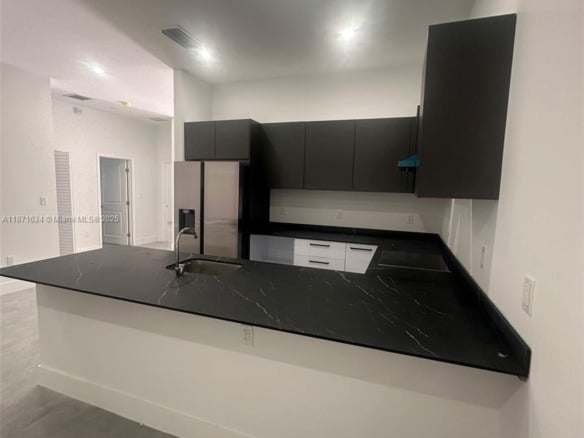 2423 NW 23rd Ln, Fort Lauderdale FL 33311 — #A11871634