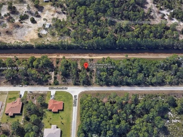 473 Willowbrook Dr, Lehigh Acres FL 33972 — #A11906222