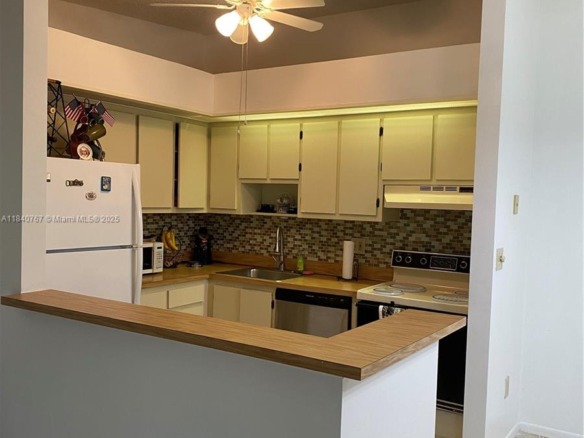 10407 E Clairmont Cir # 210, Tamarac FL 33321 — #A11840767