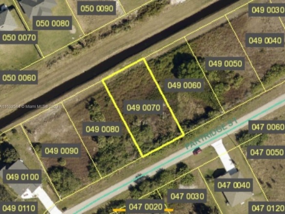 209 Partridge St, Lehigh Acres FL 33974 — #A11692584