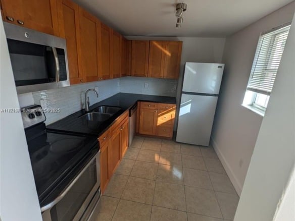 2800 NW 56th Ave # B202, Lauderhill FL 33313 — #A11721870