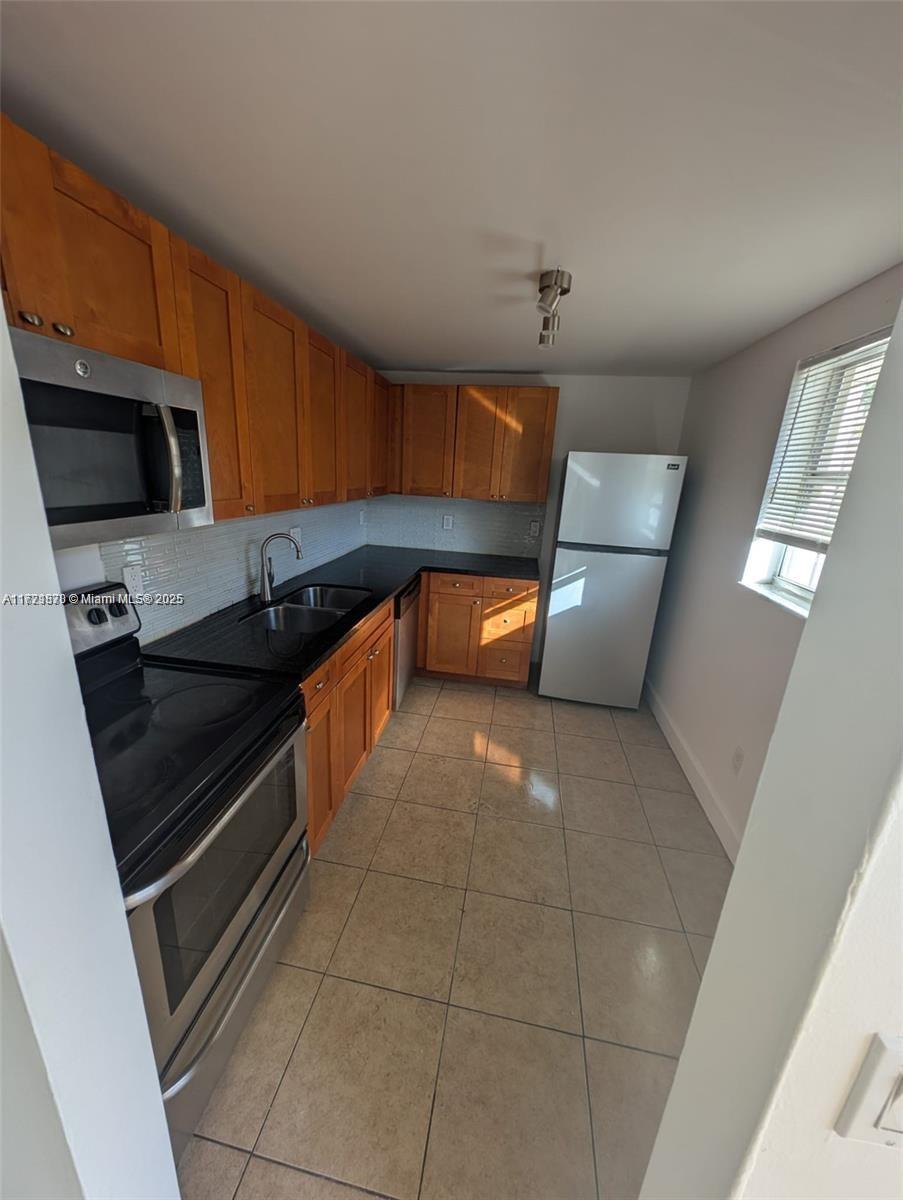 2800 NW 56th Ave # B202, Lauderhill FL 33313 — #A11721870