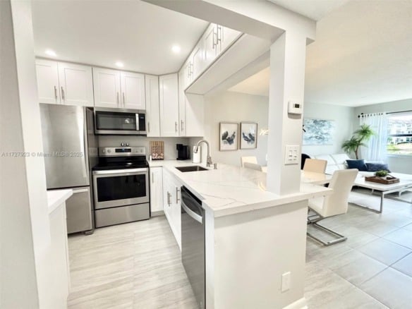 3405 NW 48th Ave # 407, Lauderdale Lakes FL 33319 — #A11727923