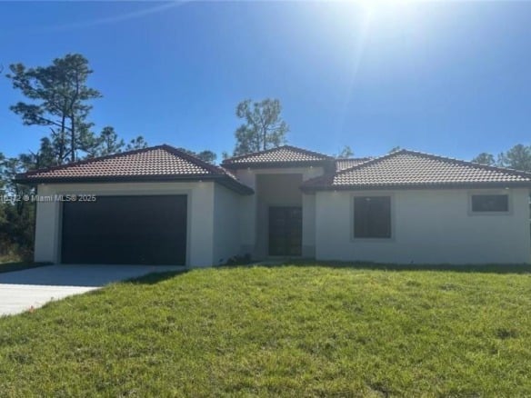2002 E 13th St, Lehigh Acres FL 33972 — #A11810372