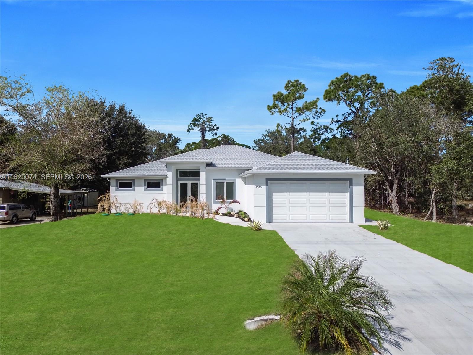 1215 Fitch Ave, Lehigh Acres FL 33972 — #A11825074