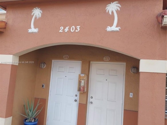 2403 W 76th St # 203, Hialeah FL 33016 — #A11831658