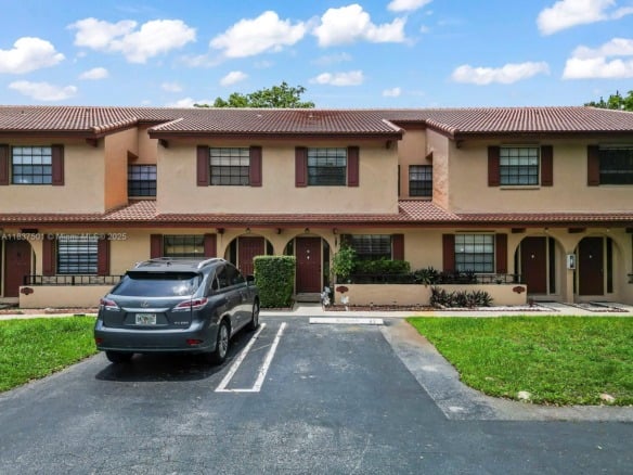 10942 W Sample Rd # E1, Coral Springs FL 33065 — #A11837501
