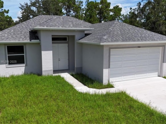 739 Sunrise Blvd, Lehigh Acres FL 33974 — #A11852668