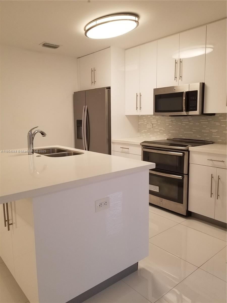 83dcefb7-7251 2651 NE 212th Ter # 103, Miami FL 33180 — #A11854044