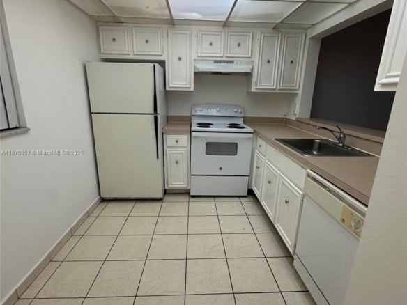 17911 NW 68th Ave # N206, Hialeah FL 33015 — #A11870257