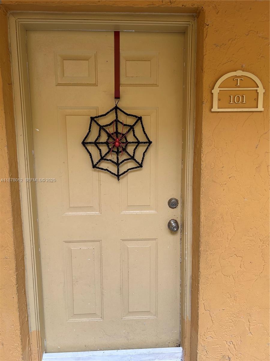17901 NW 68th Ave # T101, Hialeah FL 33015 — #A11878012