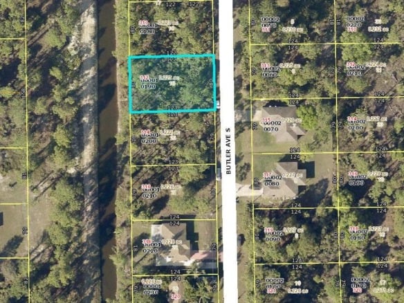 312 Butler Avenue S, Lehigh Acres FL 33974 — #R10832833