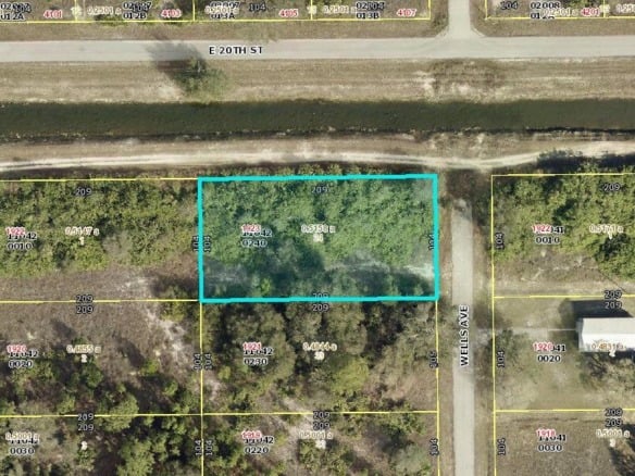 1923 Wells Avenue, Lehigh Acres FL 33972 — #R11004333