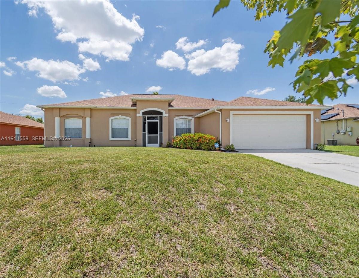 84b12bae-2958 821 CARLFIELD AVE, Lehigh Acres FL 33971 — #A11614558