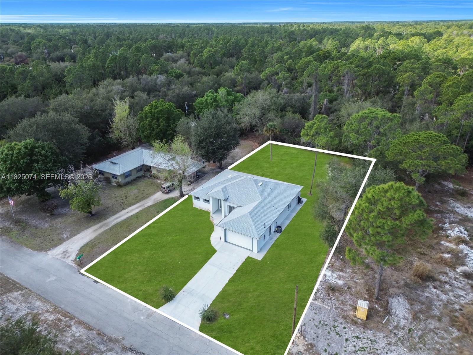 1215 Fitch Ave, Lehigh Acres FL 33972 — #A11825074