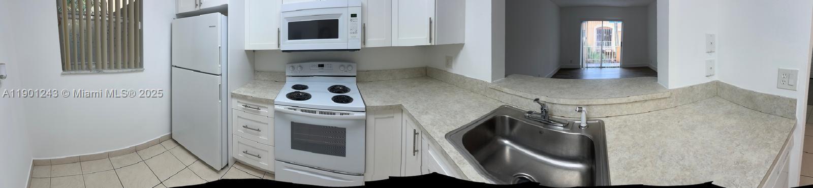 18101 NW 68th Ave # E210, Hialeah FL 33015 — #A11901243