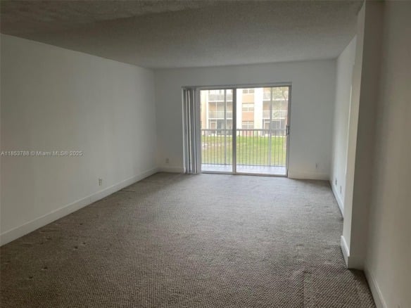 1075 Riverside Dr # 203, Coral Springs FL 33071 — #A11853788