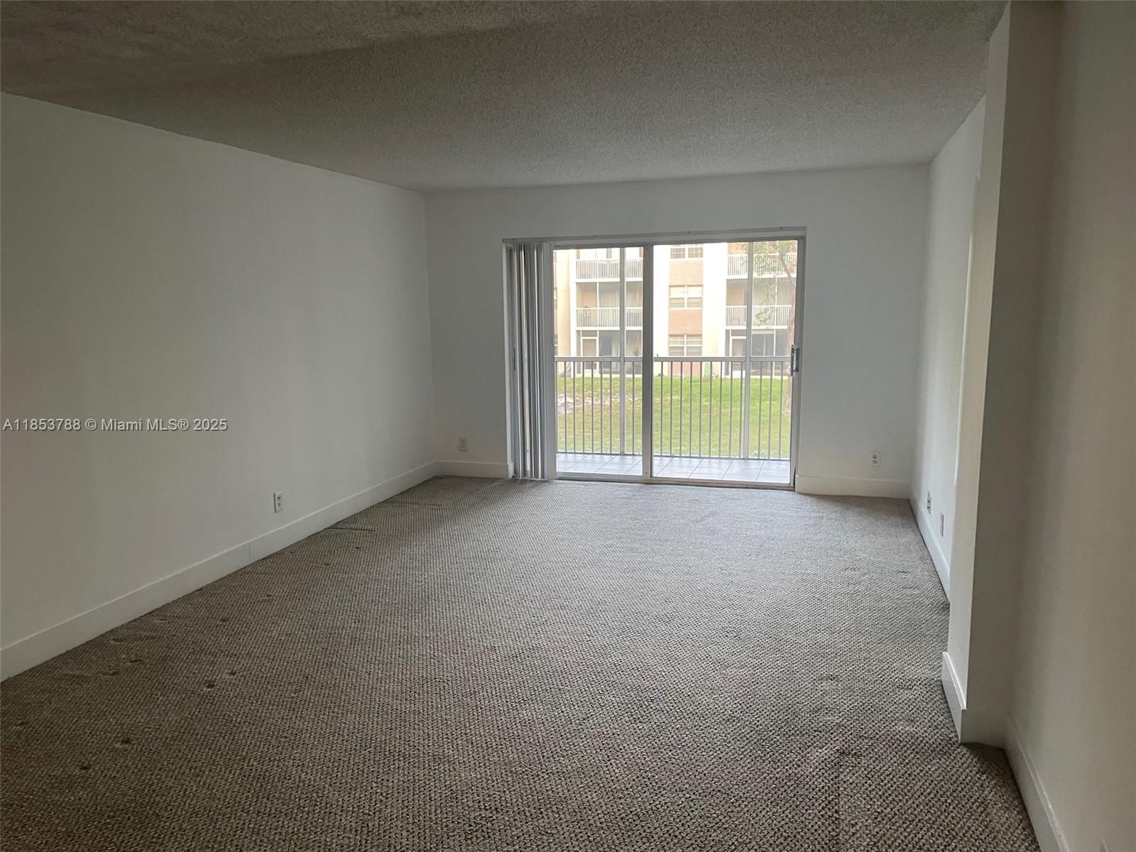 84b12bae-6301 1075 Riverside Dr # 203, Coral Springs FL 33071 — #A11853788