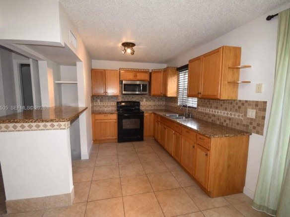 7501 Kimberly Blvd # 104, North Lauderdale FL 33068 — #A11859505