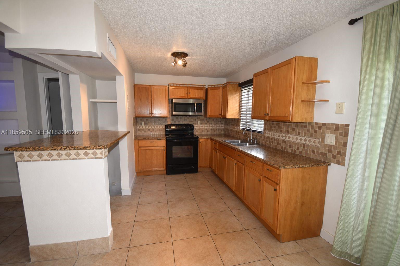 7501 Kimberly Blvd # 104, North Lauderdale FL 33068 — #A11859505