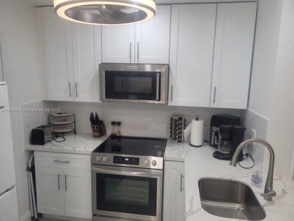 300 Golden Isles Dr # 217, Hallandale Beach FL 33009 — #A11808476