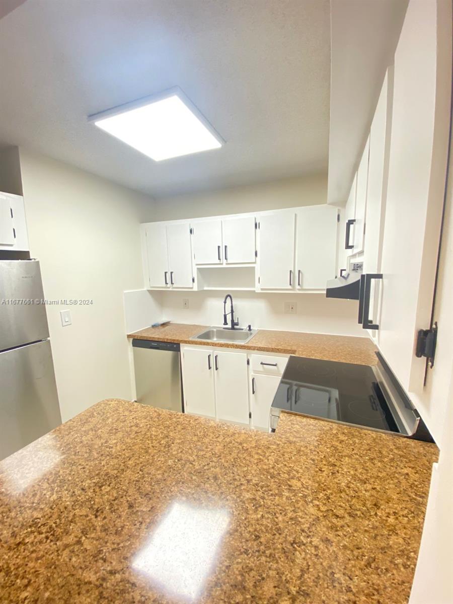 2029 NW 46th Ave # E308, Lauderhill FL 33313 — #A11677661