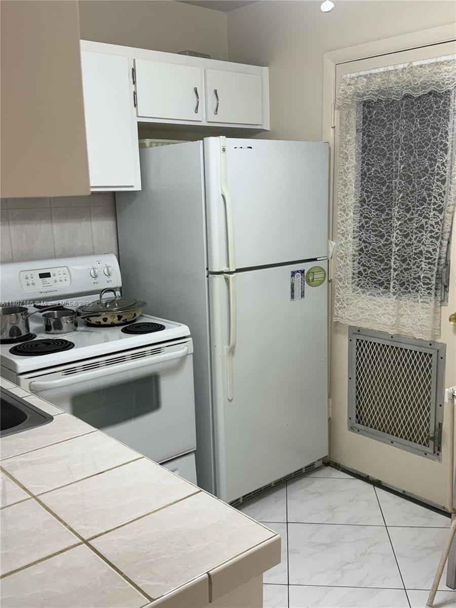 f3b61b38-5154 1395 NE 167th St # 203, Miami FL 33162 — #A11807165