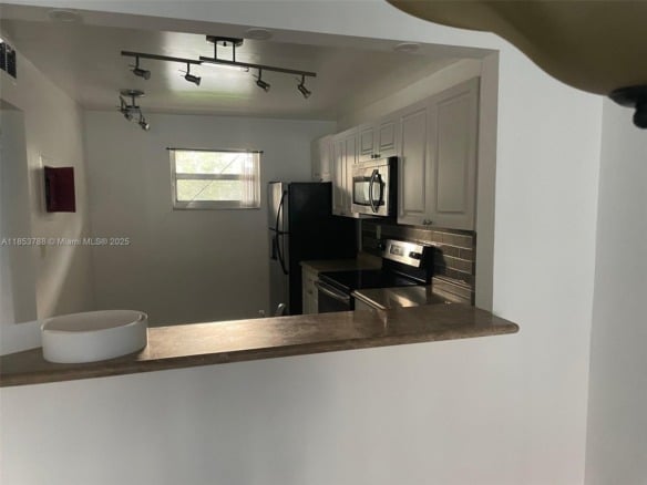 1075 Riverside Dr # 203, Coral Springs FL 33071 — #A11853788