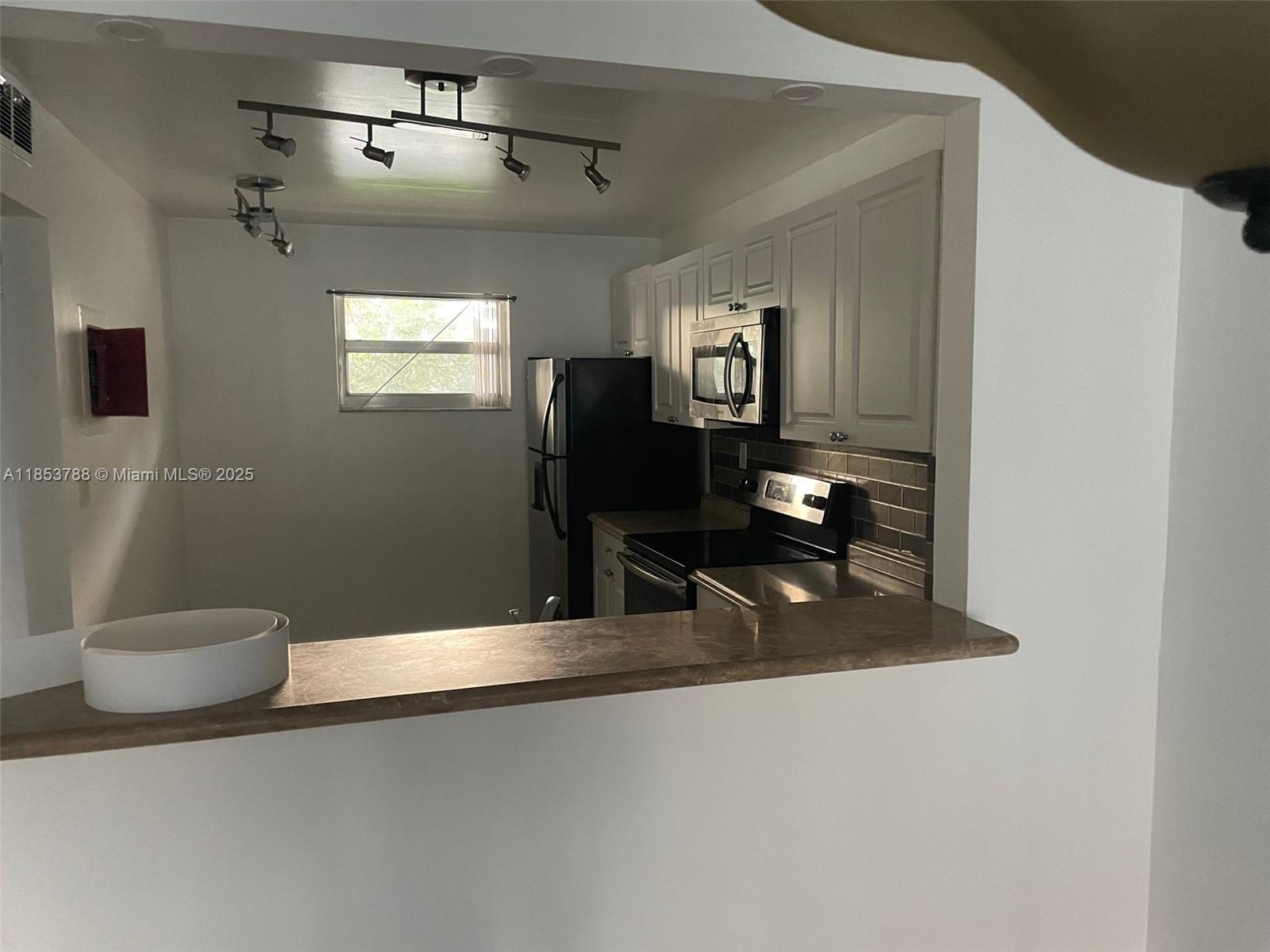 f3b61b38-6473 1075 Riverside Dr # 203, Coral Springs FL 33071 — #A11853788
