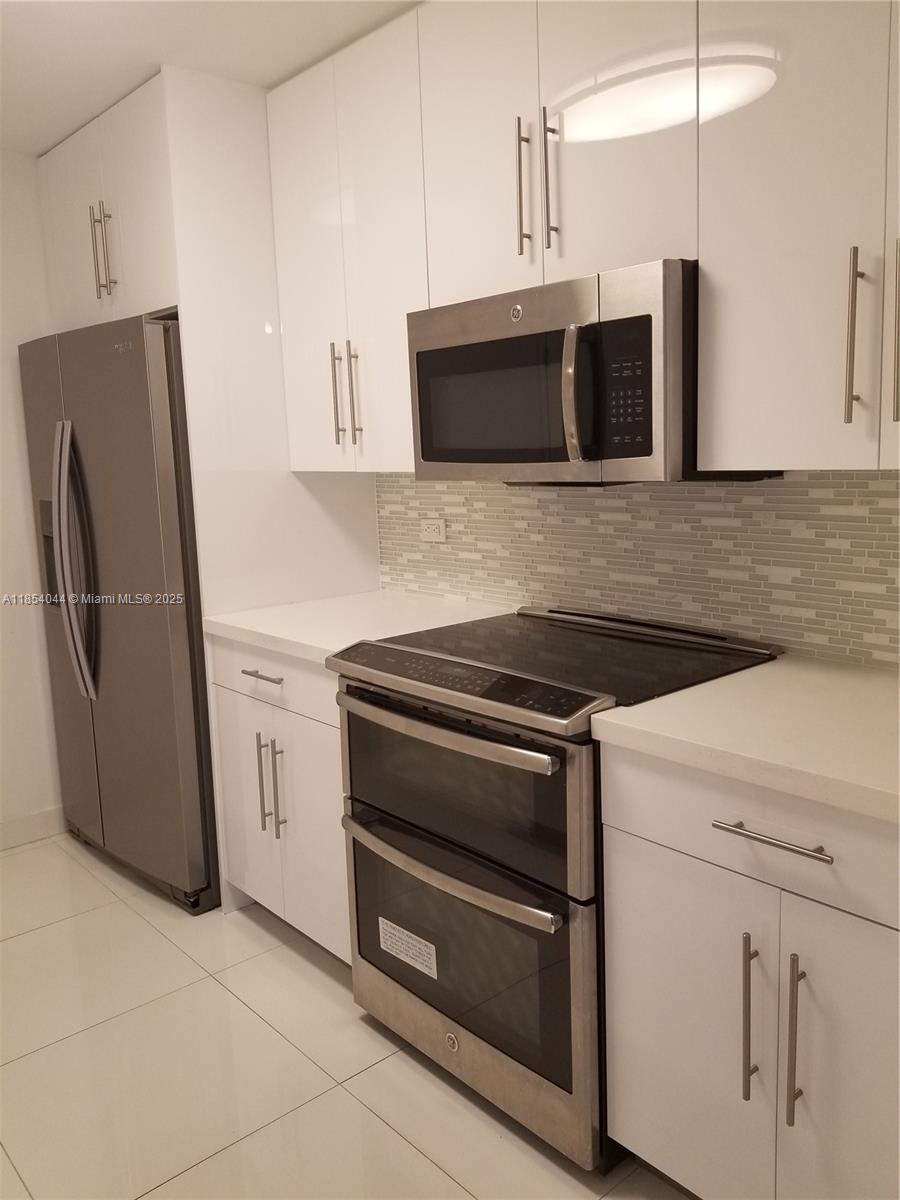 f3b61b38-6488 2651 NE 212th Ter # 103, Miami FL 33180 — #A11854044