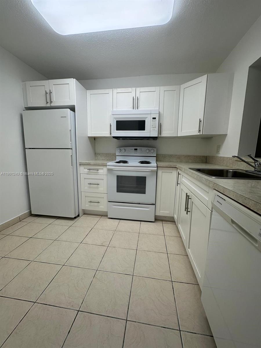 18101 NW 68th Ave # E210, Hialeah FL 33015 — #A11901243